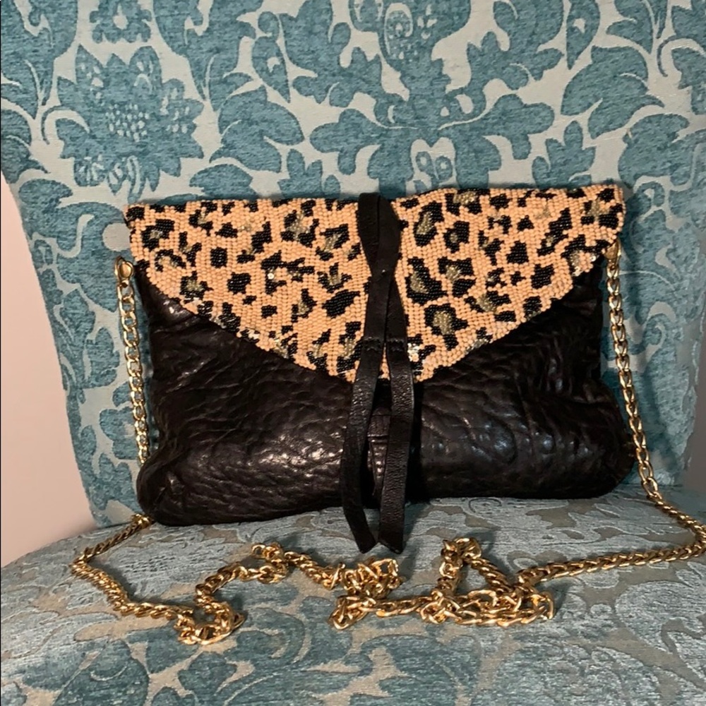 Black gold and brown clutch